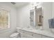 Bright bathroom with a single sink marble vanity and enclosed shower at 73 Glenmoor Dr, Cherry Hills Village, CO 80113