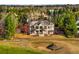 Stunning estate home overlooking the lush golf course with manicured lawn and mature landscaping at 73 Glenmoor Dr, Cherry Hills Village, CO 80113