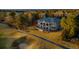 Beautiful home with a view of the lush golf course, mature trees, and perfectly manicured lawn at 73 Glenmoor Dr, Cherry Hills Village, CO 80113