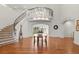Grand foyer with a sweeping staircase, chandelier, and beautiful hardwood floors, perfect for welcoming guests at 73 Glenmoor Dr, Cherry Hills Village, CO 80113