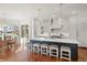 Bright, modern kitchen featuring a large island with seating and state-of-the-art appliances at 73 Glenmoor Dr, Cherry Hills Village, CO 80113
