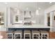 Beautiful kitchen with an expansive island, custom cabinetry, and high-end stainless steel appliances at 73 Glenmoor Dr, Cherry Hills Village, CO 80113