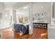 Open-concept kitchen with a wet bar, an island with seating, and a seamless transition to other living spaces at 73 Glenmoor Dr, Cherry Hills Village, CO 80113
