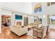 Bright living room with a fireplace, large windows and high ceilings at 73 Glenmoor Dr, Cherry Hills Village, CO 80113