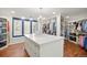 Large walk-in closet with a center island, custom shelves, and natural light at 73 Glenmoor Dr, Cherry Hills Village, CO 80113