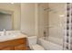 Bathroom features a combination shower and tub with marble surround and vanity at 180 Outpost Ln, Evergreen, CO 80439