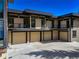 Modern home features a four-car garage and multiple balconies at 180 Outpost Ln, Evergreen, CO 80439