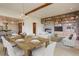 Open floorplan showcasing the dining room, living area with fireplace, and kitchen at 180 Outpost Ln, Evergreen, CO 80439