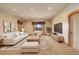 Bright and airy living room features a neutral color palette and views from the window at 180 Outpost Ln, Evergreen, CO 80439