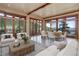 Open-concept living space with dining area, wood floors, and scenic mountain views at 180 Outpost Ln, Evergreen, CO 80439