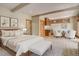Serene main bedroom with a seating area, wet bar, and luxurious ensuite bathroom at 180 Outpost Ln, Evergreen, CO 80439