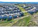 An aerial view captures the home's location within a neighborhood featuring manicured lawns and sidewalks at 476 Silver Rock Trl, Castle Rock, CO 80104