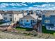 Aerial view of the home's backyard featuring a patio, artificial lawn and fenced yard at 476 Silver Rock Trl, Castle Rock, CO 80104