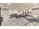This living room boasts comfortable seating, recessed lighting, and a stylish area rug at 476 Silver Rock Trl, Castle Rock, CO 80104