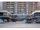 A high-rise apartment building with a statue at the entrance and street view at 1020 15Th St # 32K, Denver, CO 80202