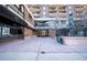 A high-rise apartment building entrance, with street view and sidewalk access at 1020 15Th St # 32K, Denver, CO 80202