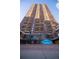 A towering high-rise apartment building featuring individual balconies and city living at 1020 15Th St # 32K, Denver, CO 80202