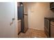 The kitchen features tile flooring, stainless steel refrigerator and matching oven at 1020 15Th St # 32K, Denver, CO 80202