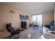 Bright living room featuring sliding glass doors, modern furniture, and neutral carpet at 1020 15Th St # 32K, Denver, CO 80202