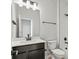 Bathroom with white subway tile, dark fixtures, and a dark vanity at 2839 E 103Rd Dr, Thornton, CO 80229