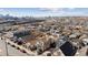 Aerial view of a neighborhood with a mix of houses and buildings with the city in the background at 4445 Pearl St, Denver, CO 80216