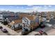 Charming gray two-story home with inviting curb appeal and a view of the city skyline in the background at 4445 Pearl St, Denver, CO 80216
