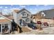 Attractive two-story home with gray siding and well-kept landscaping, offering a welcoming curb appeal at 4445 Pearl St, Denver, CO 80216