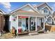 Charming bungalow with a cozy front porch, ideal for relaxing and enjoying the neighborhood ambiance at 4445 Pearl St, Denver, CO 80216