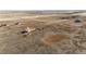 An high definition drone shot shows a single Gathering house with acreage at 6201 S Vanderhoof St, Bennett, CO 80102