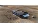 Aerial view showcasing a ranch style home with fenced in front yard at 6201 S Vanderhoof St, Bennett, CO 80102