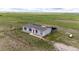 Charming single Gathering home with fencing on large acreage with grass and native plants at 6201 S Vanderhoof St, Bennett, CO 80102