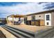 Back deck featuring a pergola, outdoor kitchen area, providing space for entertaining and relaxing, with access to the house at 6201 S Vanderhoof St, Bennett, CO 80102