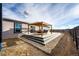 Backyard deck with pergola, providing an outdoor living space, featuring stairs to the yard, with a view at 6201 S Vanderhoof St, Bennett, CO 80102
