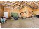 Barn interior with storage for hay and equipment, perfect for farm activities, featuring a well-organized layout at 6201 S Vanderhoof St, Bennett, CO 80102