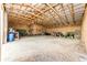 Spacious barn interior with high ceilings, perfect for storage or a workshop, offering potential for various uses at 6201 S Vanderhoof St, Bennett, CO 80102