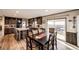 Modern dining room next to kitchen with sliding glass door to the patio deck at 6201 S Vanderhoof St, Bennett, CO 80102