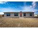 The front exterior features a bright red front door and a well-manicured lawn at 6201 S Vanderhoof St, Bennett, CO 80102