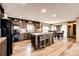 Spacious kitchen features a large island, modern appliances, and stylish wood cabinets at 6201 S Vanderhoof St, Bennett, CO 80102
