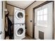 Convenient laundry area with stacked washer and dryer at 6201 S Vanderhoof St, Bennett, CO 80102