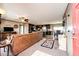 Open-concept living room boasts lots of natural light and flows into the dining and kitchen areas at 6201 S Vanderhoof St, Bennett, CO 80102