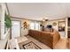 Comfortable living room featuring a plush sofa and great natural light at 6201 S Vanderhoof St, Bennett, CO 80102