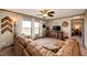 Bright living room with large windows, comfortable seating, and a view of the open land at 6201 S Vanderhoof St, Bennett, CO 80102