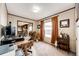 This office includes a desk, chair, view, and entryway to the kitchen at 6201 S Vanderhoof St, Bennett, CO 80102