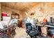 Cluttered storage room, perfect for hobbies, equipped with shelving and furniture, maximizing space at 6201 S Vanderhoof St, Bennett, CO 80102
