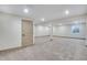 Spacious basement with neutral carpet, recessed lighting, and white columns at 24593 E 34Th Ave, Aurora, CO 80019
