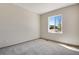 Bedroom with a large window and neutral paint at 24593 E 34Th Ave, Aurora, CO 80019