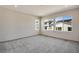 Spacious bedroom with soft carpeting, multiple windows with neighborhood views, and neutral walls at 24593 E 34Th Ave, Aurora, CO 80019