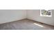 Sunlit bedroom with neutral carpet and base trim throughout at 24593 E 34Th Ave, Aurora, CO 80019
