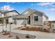 Charming single Gathering home featuring a three car garage, stone accents, and drought resistant landscaping at 24593 E 34Th Ave, Aurora, CO 80019