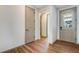 Bright hallway with wood floors and neutral paint throughout at 24593 E 34Th Ave, Aurora, CO 80019